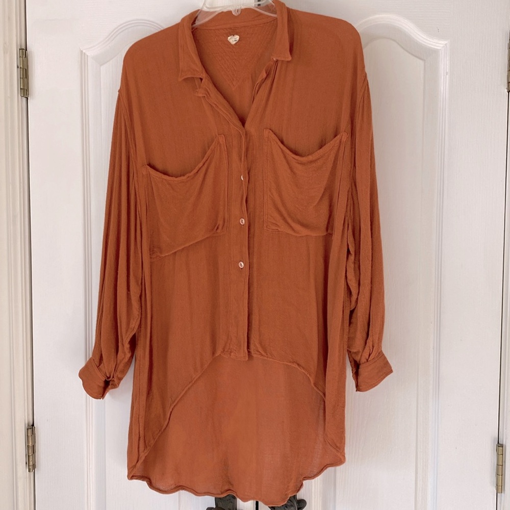 Women’s size large button up top. Size large.